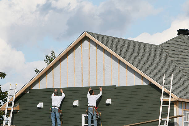 Professional Vinyl Siding technician working in West Newton, MA